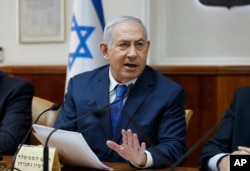 FILE - Israeli Prime Minister Benjamin Netanyahu chairs the weekly cabinet meeting at his office in Jerusalem, Dec. 16, 2018.