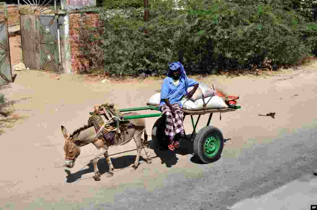 A Mogadishu resident moves goods across the city. Mogadishu has seen a decrease in fighting since AMISOM forces repelled an offensive launched by insurgent group al-Shabab in September.