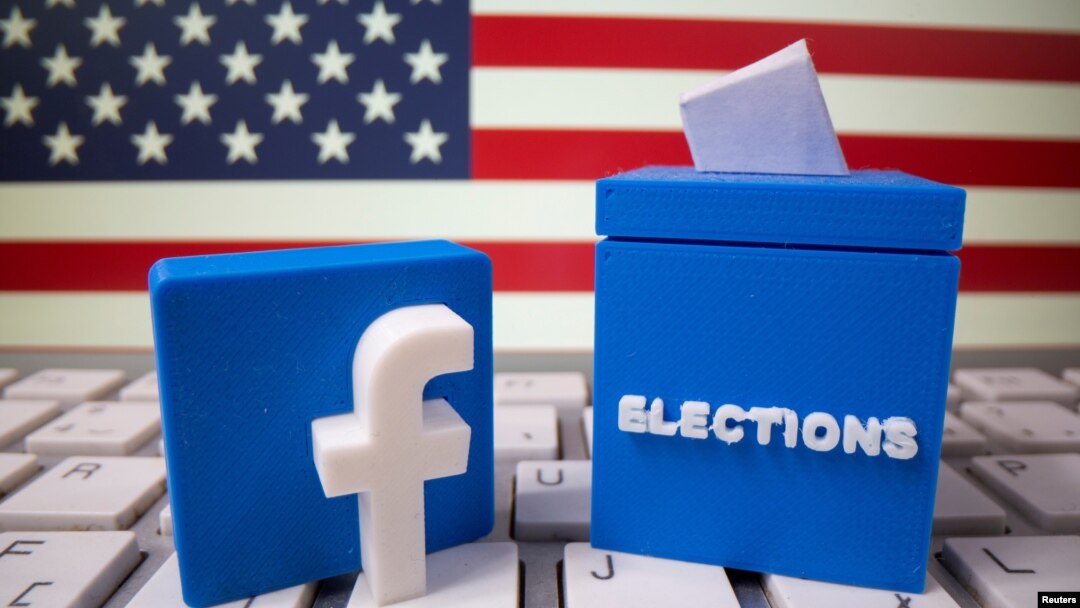FILE PHOTO: A 3D-printed elections box and Facebook logo are placed on a keyboard in front of U.S. flag in this illustration taken Oct. 6, 2020. 