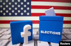 A 3D-printed elections box and Facebook logo are placed on a keyboard in front of U.S. flag in this illustration taken Oct. 6, 2020.