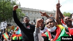 FILE - People gather to protest against the treatment of Ethiopia's ethnic Oromo group, outside Downing Street in London, Britain, July 3, 2020. 