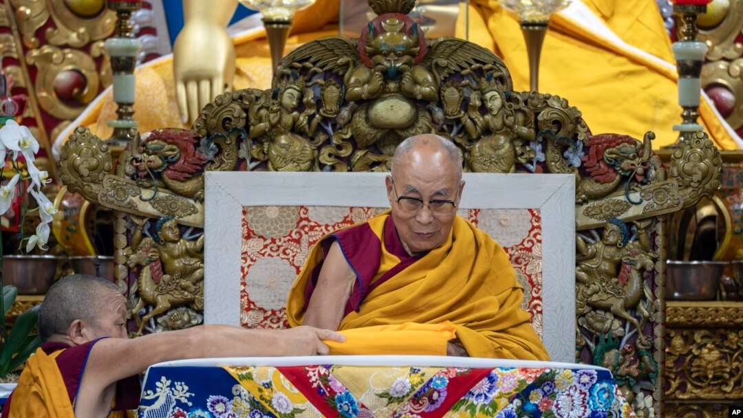 FILE - Tibetan spiritual leader the Dalai Lama sits on his ceremonial chair after he arrived at the Tsuglakhang temple to give a sermon at the request of a Buddhist group from Taiwan in Dharamshala, India, Sept. 30, 2024.