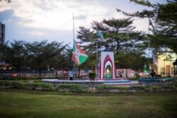The Burundian national flag is taken down at the independent square in downtown Bujumbura as Burundi mourns the death of Burundian President Pierre Nkurunziza, June 9, 2020.