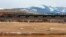 FILE - A train hauls oil into Glacier National Park near the Badger-Two Medicine National Forest in northwest Montana. U.S. Interior Secretary Ryan Zinke appears to be carving out an exception for his home state from the Trump administration’s agenda to open more public lands to natural resources development.