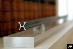 FILE - A replica of the International Meter Prototype is pictured at the International Bureau of Weights and Measures, in Sevres, near Paris, Oct. 17, 2018.