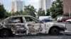 Damaged car sit in northern neighborhood of Amiens, France, August 15, 2012.