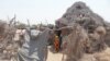 FILE - Displaced Yemeni children are pictured at a makeshift camp for people who fled fighting between Houthi rebels and the Saudi-backed government forces, near the conflict zone in Yemen's western province of Hodeida, on August 21, 2021.