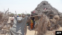 FILE - Displaced Yemeni children are pictured at a makeshift camp for people who fled fighting between Houthi rebels and the Saudi-backed government forces, near the conflict zone in Yemen's western province of Hodeida, on August 21, 2021.