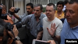 U.S. pastor Andrew Brunson reacts as he arrives at his home after being released from the prison in Izmir, Turkey, July 25, 2018.