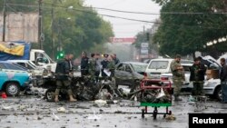 Investigators work at a suicide bomb blast site in Vladikavkaz in Russia's restive North Caucasus, Sep. 10, 2010. 