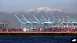 This Monday, Feb. 13, 2017 photo shows shipping container cranes at the Port of Long Beach, California. (AP Photo/Nick Ut)