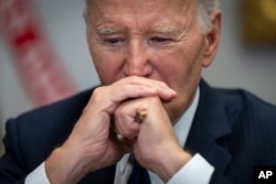 U.S. President Joe Biden listens during a White House briefing regarding the federal response to the spread of wildfires in the Los Angeles area, Jan. 9, 2025.