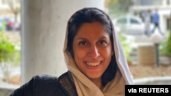 FILE - Caption A British-Iranian aid worker, Nazanin Zaghari-Ratcliffe, poses for a photo after she was released from house arrest in Tehran, Iran, March 7, 2021.