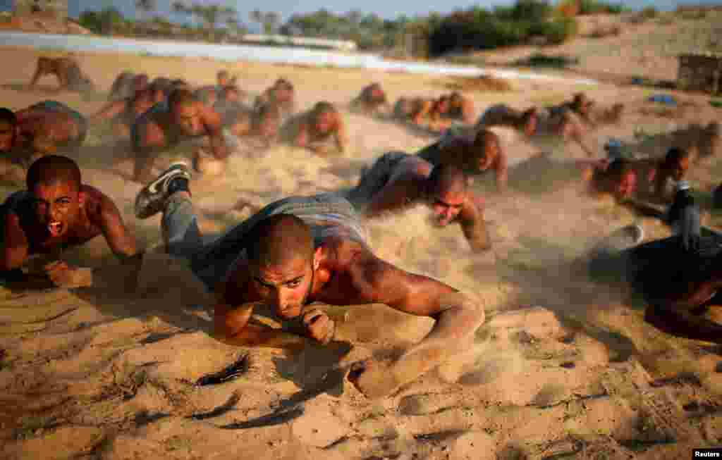 Palestinian cadets demonstrate their skills at a police college run by the Hamas-led interior ministry, in Khan Younis in the southern Gaza Strip.