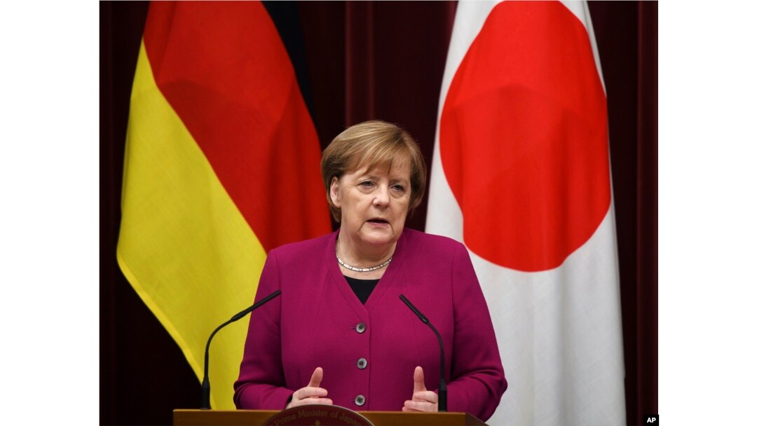 German Chancellor Angela Merkel answers a question during a joint press conference with Japanese Prime Minister Shinzo Abe following their summit meeting at Abe's official residence in Tokyo, Feb. 4, 2019.