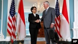 FILE - Secretary of State​ Rex Tillerson shakes hands with Indonesian Foreign Minister Retno Marsudi, May 4, 2017, at the State Department in Washington. 