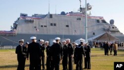 Члени екіпажу бойового корабля USS Sioux City у Військово-морській академії США в Аннаполісі, штат Меріленд. AP Photo/Patrick Semansky