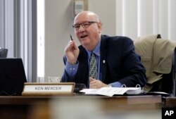 Texas school board member Ken Mercer asks a question as the board listens to public testimony on history curriculum, Nov. 13, 2018, in Austin, Texas.