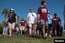 Students and parents arrive for voluntary campus orientation at the Marjory Stoneman Douglas High School, Feb. 25, 2018. The school reopens Wednesday, following the Valentine's Day mass shooting in Parkland, Florida.