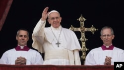 FILE - Pope Francis delivers the Urbi et Orbi (Latin for ' to the city and to the world' ) Christmas' day blessing from the main balcony of St. Peter's Basilica at the Vatican, Dec. 25, 2016. 