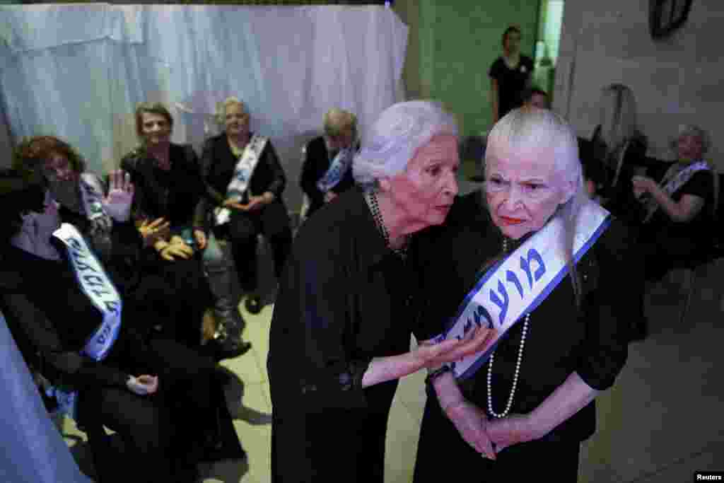 Holocaust survivors are seen backstage during a beauty contest for survivors of the Nazi genocide in the northern Israeli city of Haifa, Nov. 24, 2015.