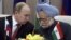 Russian President Vladimir Putin, left, talks with Indian Prime Minister Manmohan Singh at a press conference after signing weapons deals worth billions in New Delhi, India, Monday, Dec. 24, 2012. 