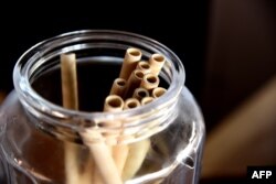Bamboo straws are stored in a jar on a table at the Copacabana restaurant on Yoff Virage beach in Dakar, Senegal, Sept. 3, 2019.