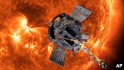 FILE - This image made available by NASA shows an artist's rendering of the Parker Solar Probe approaching the Sun. The probe made history on Tuesday, flying closer to the sun than any other spacecraft. (Johns Hopkins APL/NASA)