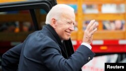 FILE - Former U.S. Vice President Joe Biden, a potential 2020 Democratic presidential candidate, arrives at a rally with striking workers in Boston, April 18, 2019.