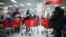 FILE - People shop inside a Target store during Black Friday sales in the Brooklyn borough of New York, Nov. 29, 2013. 