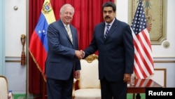 Venezuela's President Nicolas Maduro shakes hands with U.S. diplomat Thomas Shannon during their meeting at Miraflores Palace in Caracas, Venezuela, June 22, 2016.