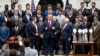  President Donald Trump stands with New England Patriots coach Bill Belichick, left, owner Robert Kraft, right, and team members during a ceremony on the South Lawn of the White House in Washington, April 19, 2017. Trump honored the team for their Super Bowl LI victory.