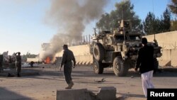 Smoke bellows after a suicide car bomb blast attacked a military convoy in Lashkar Gah, Helmand province, Afghanistan, Nov. 15, 2015.