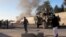 Smoke bellows after a suicide car bomb blast attacked a military convoy in Lashkar Gah, Helmand province, Afghanistan, Nov. 15, 2015.