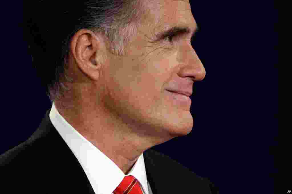 Mitt Romney smiles at President Barack Obama, Oct. 3, 2012, in Denver.