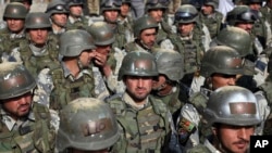 FILE - Afghan special police forces attend their graduation ceremony at a special forces training center in Kabul, Feb. 22, 2018. 