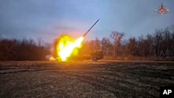 In this photo taken from a video distributed by Russian Defense Ministry Press Service on Feb. 6, 2025, a Russian self-propelled multiple rocket launcher is fired toward a Ukrainian position at an undisclosed location in the Kursk region border area. 