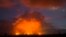 Volcanic activity from the Malama Ki and Leilani Estates neighborhoods glows in the distance from Hwy 137, May 17, 2018, near Pahoa, Hawaii