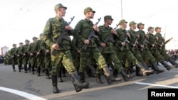 Pro-Russian rebels march during a rehearsal for the Victory Day military parade in Donetsk, Ukraine, May 5, 2015.