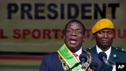 FILE - Zimbabwe's President Emmerson Mnangagwa speaks after being sworn in at the presidential inauguration ceremony in the capital Harare, Zimbabwe, Nov. 24, 2017.