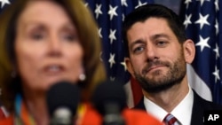 House Speaker Paul Ryan of Wis. listens as House Minority Leader Nancy Pelosi of Calif. speaks on Capitol Hill in Washington, Dec. 9, 2015, before Ryan signed legislation that changes how the nation's public schools are evaluated, rewriting the landmark No Child Left Behind education law of 2002.