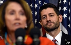 FILE - House Speaker Paul Ryan of Wis. listens as House Minority Leader Nancy Pelosi of Calif. speaks on Capitol Hill in Washington, Dec. 9, 2015, before Ryan signed legislation that changes how the nation's public schools are evaluated, rewriting the landmark N