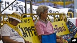 Anti-government demonstrators listen to speeches near Government House in Bangkok, Thailand. The People's Alliance for Democracy, also known as the "Yellow Shirts," are calling for marches later in the week in the capital as they pressure the government o