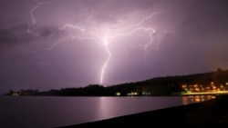 Lightning strikes are seen above Villarrica lake, in Villarrica, Chile, December 7, 2021. (REUTERS/Cristobal Saavedra Escobar)