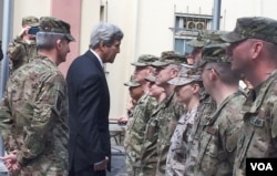 Secretary of State Kerry greets U.S. troops outside Resolute Support Headquarters following a meeting with General "Mick" Nicholson, commander of U.S. forces in Afghanistan , April 9, 2016. (Pamela Dockins/VOA)
