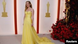 Kerry Condon poses on the champagne-colored red carpet during the Oscars arrivals at the 95th Academy Awards in Hollywood, Los Angeles, California, March 12, 2023.