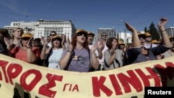 Protesters shout slogans during an anti-austerity strike in front of the parliament in Athens, Greece, November 6, 2012.