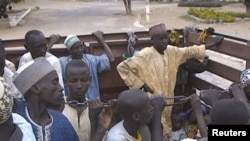 FILE - Nigerians formerly held hostage by Boko Haram militants arrive in Maroua, Cameroon, Dec. 5, 2015. They were freed by Cameroon’s military. 