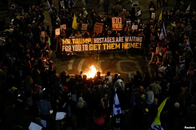 Relatives and supporters of hostages kidnapped during Hamas' Oct. 7, 2023, attack on Israel gather in Tel Aviv, Israel, to demand the release of all hostages, March 8, 2025.