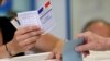 FILE - A man casts his ballot in parliamentary elections at a polling station in Marseille, southern France, June 18, 2017. 